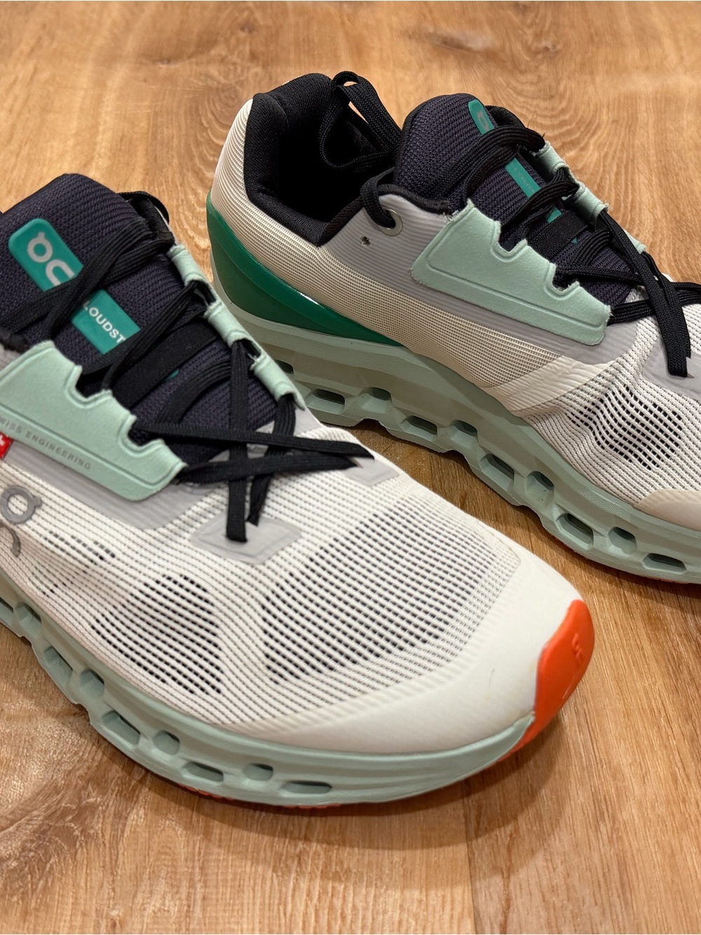 On Running Women’s Cloudnova White Mint with Orange Toe Sneakers